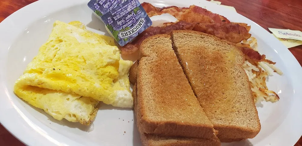 Scrambled Eggs Bacon Hash Browns and Toast